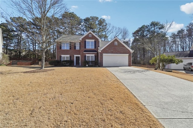 view of front of home featuring a garage and a front yard