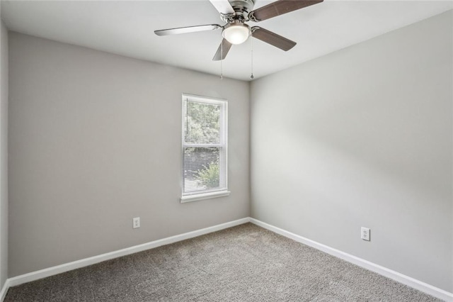 1050 Chapman Cir, Stone Mountain, GA 30088 - carpeted spare room featuring baseboards and ceiling fan