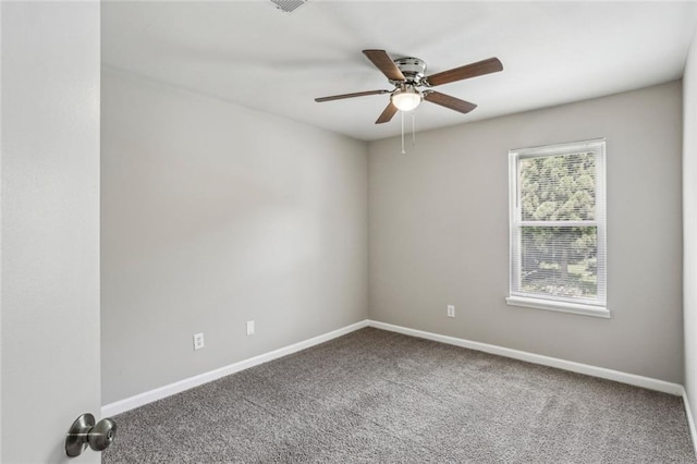 1050 Chapman Cir, Stone Mountain, GA 30088 - spare room featuring ceiling fan and carpet flooring