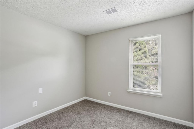 1050 Chapman Cir, Stone Mountain, GA 30088 - carpeted spare room with baseboards and a textured ceiling