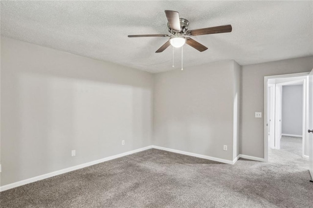 1050 Chapman Cir, Stone Mountain, GA 30088 - carpeted empty room featuring a ceiling fan and a textured ceiling