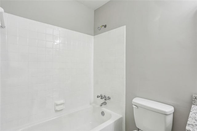 1050 Chapman Cir, Stone Mountain, GA 30088 - bathroom featuring toilet and bathing tub / shower combination