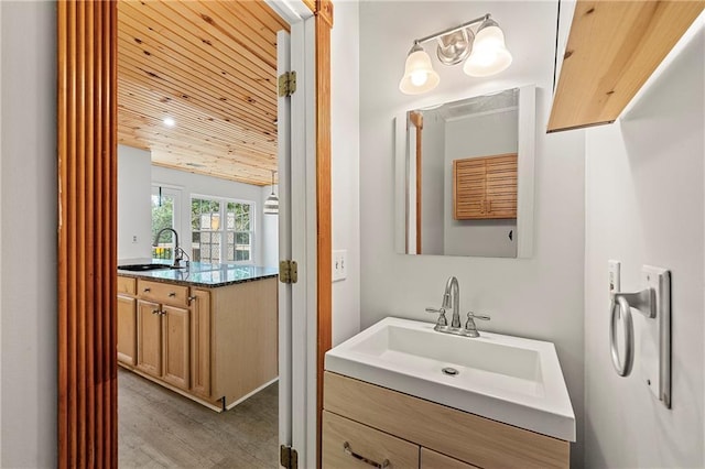 bathroom with vanity, wood ceiling, and hardwood / wood-style flooring