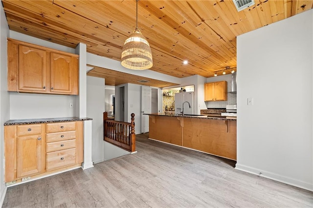 kitchen featuring stainless steel fridge with ice dispenser, decorative backsplash, hanging light fixtures, light hardwood / wood-style floors, and wood ceiling