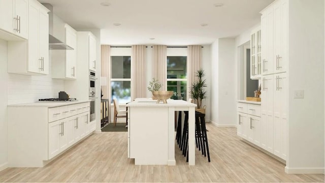 811 Atkins Ln, Woodstock, GA 30188 - kitchen featuring light wood finished floors, light countertops, decorative backsplash, and white cabinetry