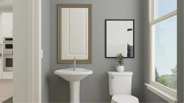 811 Atkins Ln, Woodstock, GA 30188 - half bath featuring toilet and healthy amount of natural light