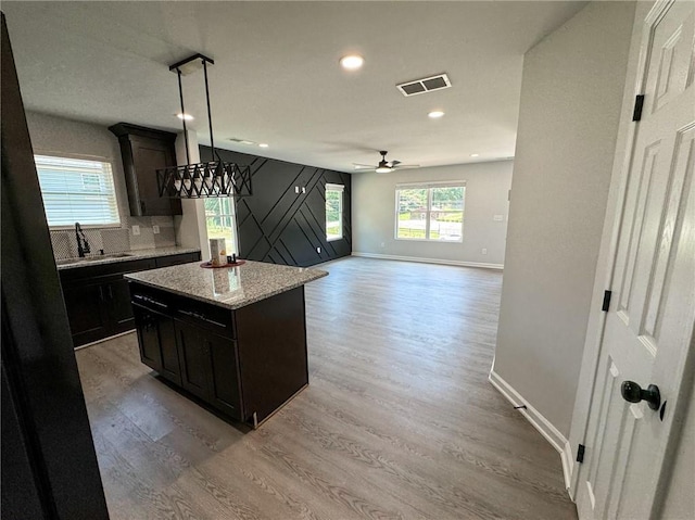 1341 E Atlanta Rd E, Stockbridge, GA 30281 - kitchen featuring light wood-style floors, baseboards, a sink, recessed lighting, and ceiling fan