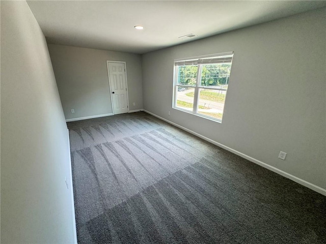 1341 E Atlanta Rd E, Stockbridge, GA 30281 - empty room with dark carpet and baseboards