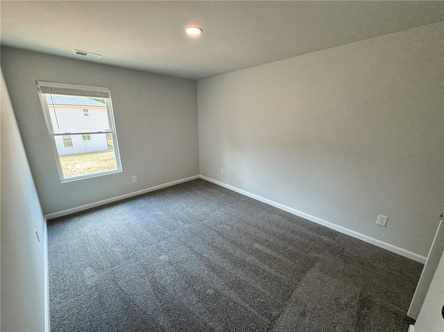 1341 E Atlanta Rd E, Stockbridge, GA 30281 - spare room with dark colored carpet, baseboards, and recessed lighting