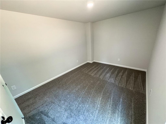 1341 E Atlanta Rd E, Stockbridge, GA 30281 - empty room featuring dark colored carpet and baseboards