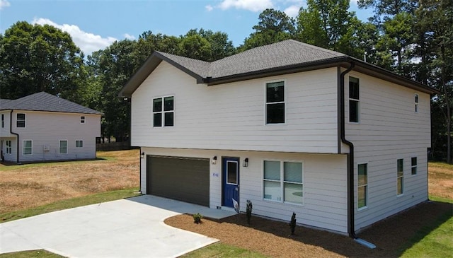 1341 E Atlanta Rd E, Stockbridge, GA 30281 - view of front of property featuring driveway, an attached garage, and a front lawn