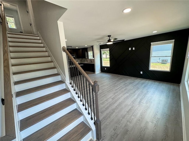 1341 E Atlanta Rd E, Stockbridge, GA 30281 - stairway with a ceiling fan, baseboards, wood finished floors, and recessed lighting