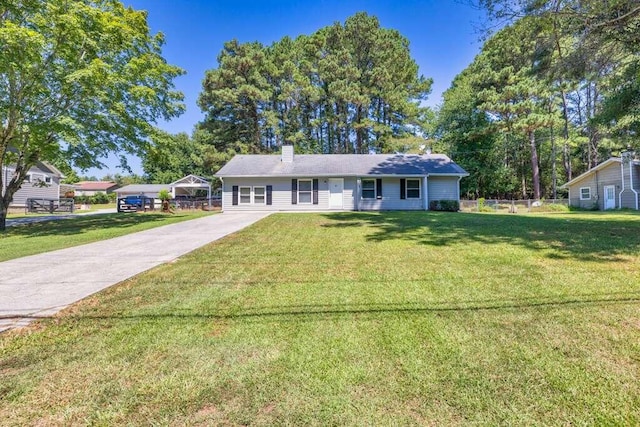 single story home featuring a front yard