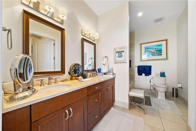 bathroom with tile patterned floors, toilet, and vanity