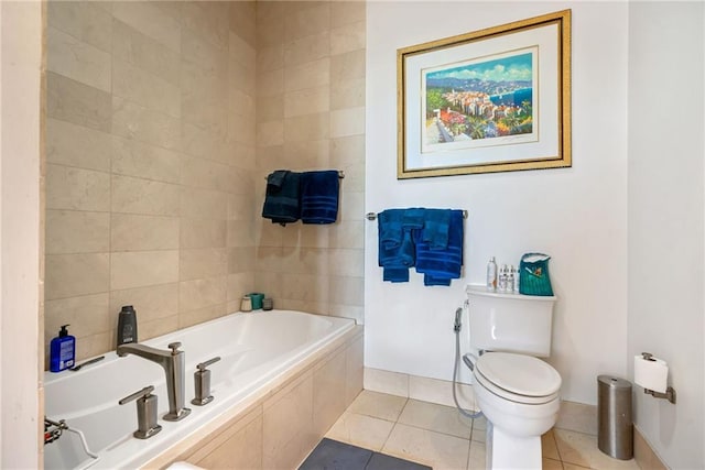 bathroom featuring toilet, tile patterned flooring, and tiled tub