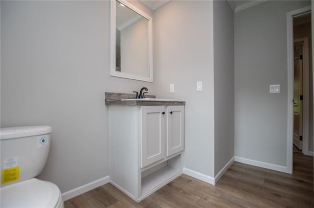 74 Preacher Smith Rd, Silver Creek, GA 30173 - half bathroom featuring toilet, ornamental molding, wood finished floors, baseboards, and vanity
