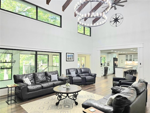 2900 Orchard Rd SW, Conyers, GA 30094 - living area with dark wood finished floors, a towering ceiling, and a chandelier