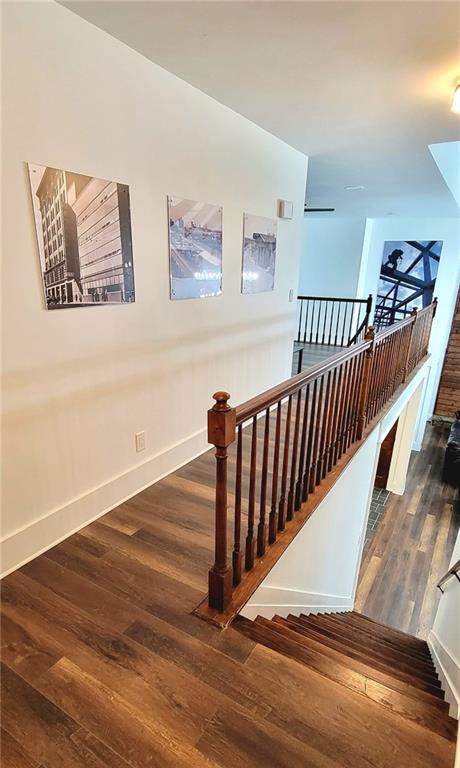 2900 Orchard Rd SW, Conyers, GA 30094 - stairs featuring wood finished floors and baseboards