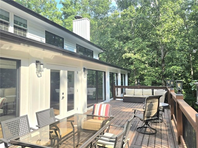 2900 Orchard Rd SW, Conyers, GA 30094 - deck with outdoor dining area, an outdoor living space, and french doors