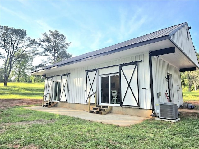 2900 Orchard Rd SW, Conyers, GA 30094 - back of house with entry steps, central air condition unit, and a yard