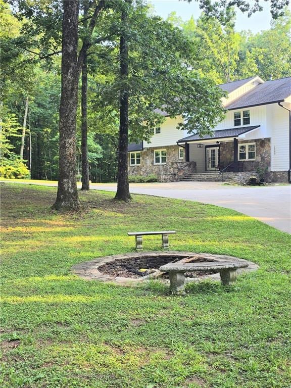 2900 Orchard Rd SW, Conyers, GA 30094 - view of property's community with a fire pit and a yard