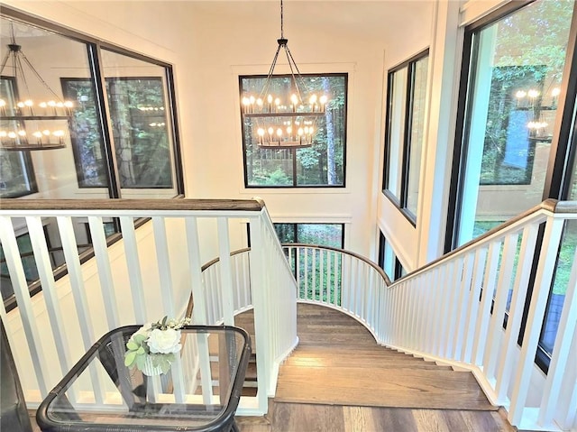 2900 Orchard Rd SW, Conyers, GA 30094 - stairway with a chandelier and wood finished floors