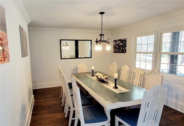 2900 Orchard Rd SW, Conyers, GA 30094 - dining room featuring dark wood-type flooring, a chandelier, ornamental molding, and baseboards