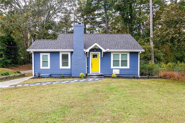 578 Cedar Ave, Atlanta, GA 30318 - view of front of property with a shingled roof, a chimney, fence, and a front lawn