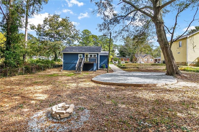 578 Cedar Ave, Atlanta, GA 30318 - view of yard with an outdoor fire pit, fence, and stairway