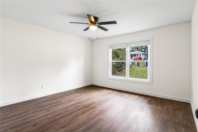 578 Cedar Ave, Atlanta, GA 30318 - spare room with dark wood-style flooring, baseboards, and a ceiling fan