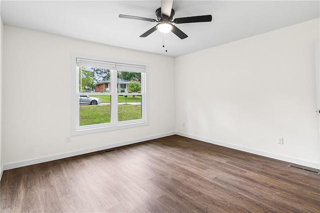 578 Cedar Ave, Atlanta, GA 30318 - unfurnished room with visible vents, baseboards, ceiling fan, and dark wood finished floors