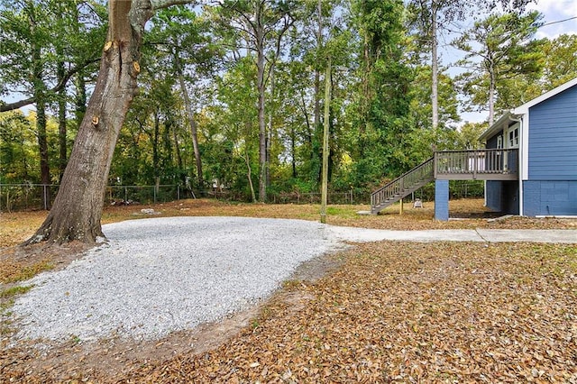 578 Cedar Ave, Atlanta, GA 30318 - view of yard with a wooden deck, fence, and stairs