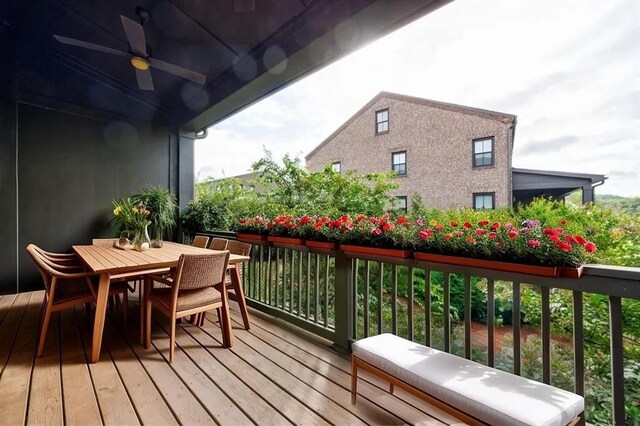 wooden deck featuring ceiling fan