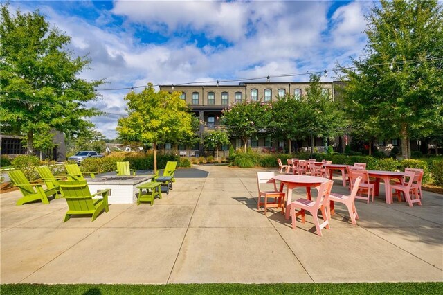 view of patio / terrace with a fire pit