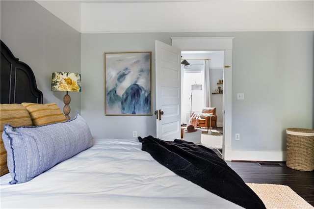 bedroom featuring dark hardwood / wood-style floors