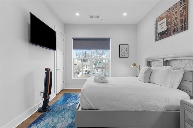 bedroom featuring wood-type flooring