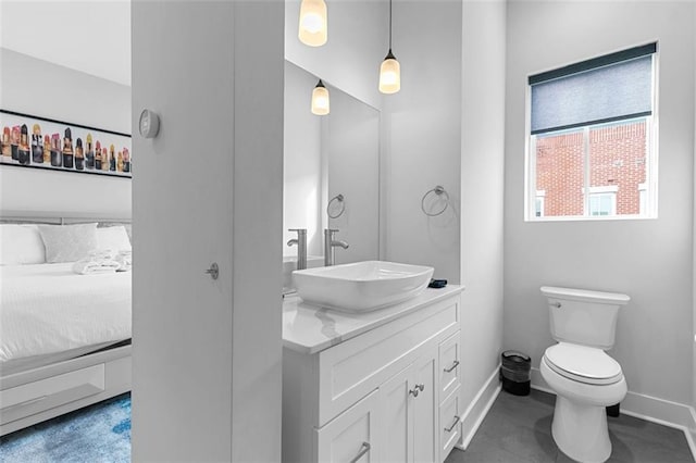 bathroom featuring toilet and vanity