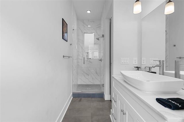 bathroom featuring walk in shower and vanity