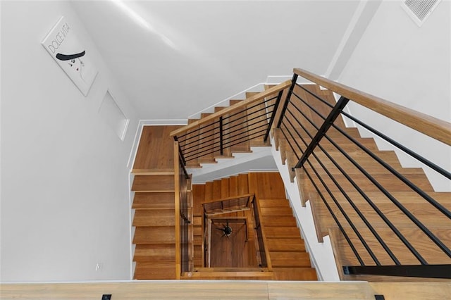 stairs with wood-type flooring