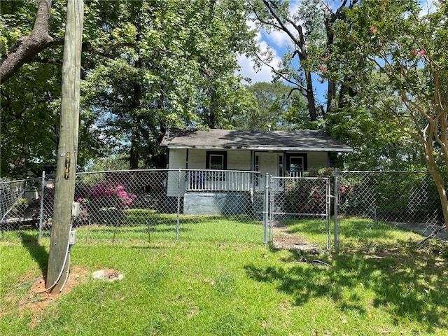 view of front of property with a fenced front yard, a front yard, a gate, and covered porch