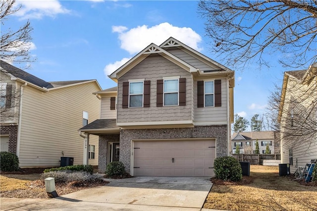 craftsman-style home featuring a garage and central AC