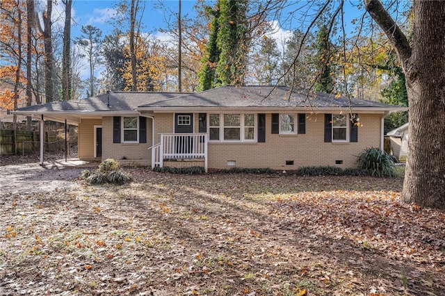 single story home featuring a carport