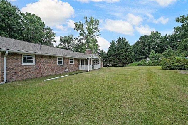 6880 Mark Turner Rd, Lithia Springs, GA 30122 - view of green lawn with a sunroom