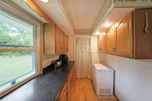 6880 Mark Turner Rd, Lithia Springs, GA 30122 - laundry room featuring plenty of natural light, light wood-style flooring, and recessed lighting