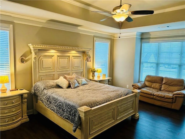 bedroom with multiple windows, crown molding, dark hardwood / wood-style floors, and ceiling fan