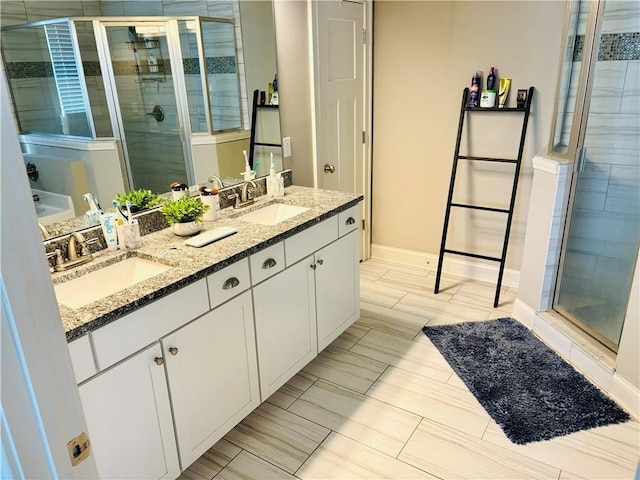 bathroom featuring walk in shower and vanity