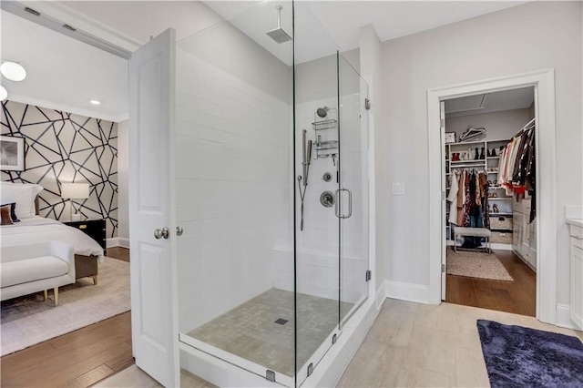 bathroom with a shower with shower door