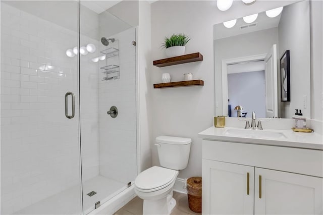 bathroom with toilet, an enclosed shower, and vanity