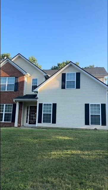635 Beddick Ln, Atlanta, GA 30349 - view of front of house with a front yard