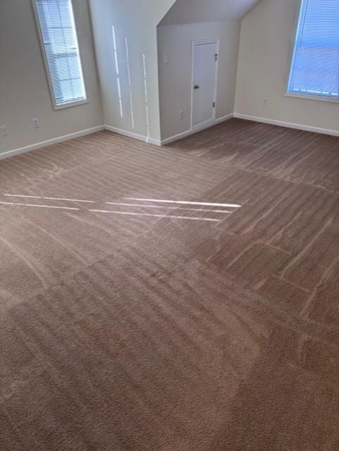635 Beddick Ln, Atlanta, GA 30349 - bonus room with carpet flooring, baseboards, and lofted ceiling
